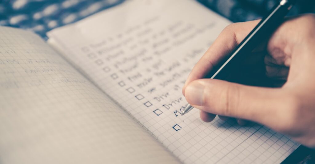 AI visibility audit checklist on a notepad for reviewing website SEO readiness